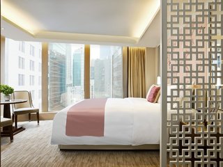 10 Modern and Stylish Places to Stay in Hong Kong - Photo 9 of 10 - Located in the heart of Hong Kong’s downtown core, The Pottinger’s 68 luxury rooms and suites celebrate Hong Kong’s rich cultural heritage with chinoiserie details and striking photographs by famous Hong Kong photographer and filmmaker, Fan Ho.
