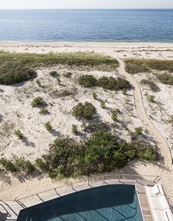 From there, a private walkway runs to the shore. 