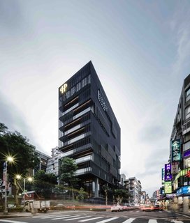 Newly opened in 2016, the postmodern Hotel Proverbs stands tall behind a minimalist dark patchwork mesh facade. Designed by noted Taiwanese architect Ray Chen, the eye-catching hotel has an equally stunning bakery and restaurant—both in stark contrast to the bustling night market that takes place in the neighborhood below. 