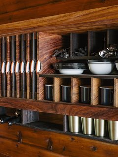 An Eclectic Pacific Northwest Cottage - Photo 6 of 13 - The kitchen was designed like a ship, with built-in storage created by Conrad Contracting.