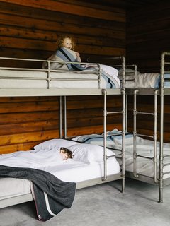 An Eclectic Pacific Northwest Cottage - Photo 7 of 13 - Bruce sourced the Restoration Hardware bunk beds (Mina, 3, claims top).