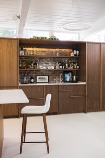 Back to the Garden - Photo 6 of 13 - The kitchen and bar millwork is ApplePly with a walnut veneer. 