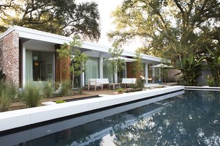 Back to the Garden - Photo 7 of 13 - To revive the original architects’ vision, studioWTA restored a four-foot roof overhang above a wall of La Cantina sliders. The shade helps limit solar gain, while a pool by Evans + Lighter Landscape Architecture provides respite on sweltering summer days.