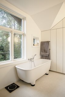 This New Old House - Photo 4 of 10 - The footed bathtub in the completely renovated bathroom is by Marc Newson for Caroma.