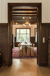 This New Old House - Photo 7 of 10 - Another view of the dining room reveals the original woodwork and character of the 19th-century structure.