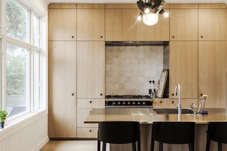 This New Old House - Photo 8 of 10 - In the renovated kitchen, a Lacanche range is surrounded by built-in storage. A state-of-the-art wall-mounted ES2 Strietman brass-and-copper espresso maker by Dutch designer Wouter Strietman adds a jewelry-like touch to the cook space.