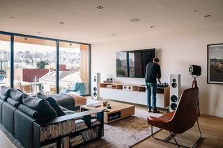 Sonos speakers are wired throughout the house, complemented by Magico S3 standing speakers in the family room. The leather Lama lounger is by Ludovica and Roberto Palomba for Zanotta. 
