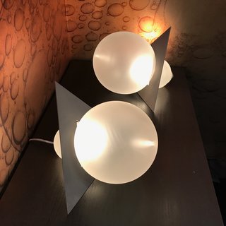 Portland-based glassblowing masters Esque partnered with designer Harry Allen on Liaison, lighting pieces made of sand-blasted glass and stainless steel. The wall covering in the background is by Flavor Paper, frequent collaborators of Esque's. 