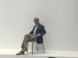 Designer Jasper Morrison poses from an armchair belonging to his new "1 Inch" collection for Emeco. Each piece is comprised of one-inch-square extruded aluminum tube, which is hand-formed using a 77-step process that has been practiced since 1946. 