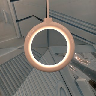 Angel by Two Parts, a Brooklyn-based firm led by architect Christo Logan. The piece is a 3D-printed, glazed ceramic pendant with a "clandestine" LED. It comes in 7 colors.