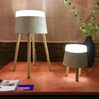 At WantedDesign, we spotted these winning Concrete table lamps by Renate Vos. Illuminated by LED, these pieces are comprised of concrete, silicone, and oak. 