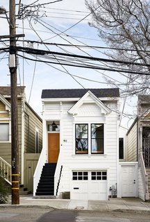 Because of the home’s historic designation, the team was limited in what they could change about the facade. They were allowed to repaint it, however, from baby blue to Gray Cloud by Benjamin Moore. 