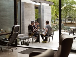 Shaded by an awning from TSM Systems and furnished with Sol y Luna pieces from Design Within Reach, the rear patio is a favorite spot for meals.