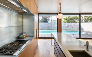 Modscape delivered this pool house that's hidden behind cinderblocks. The Australian company offers modular homes and commercial modular building services that minimize environmental impact.