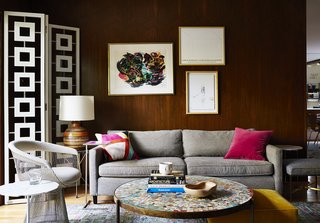A Petal end table by Richard Schultz is paired with a Platner armchair. These classics mingle with newer items, such as a Desmond room divider by Jonathan Adler and a sofa by Mitchell Gold + Bob Williams.