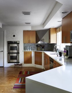 The residents added double-glaze windows, low-VOC paints, and Energy Star appliances, calling on help just once, to install the Cambria quartz countertop in the kitchen. 