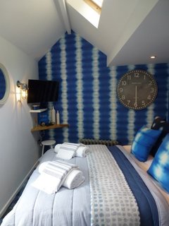 9 Small Spaces With Color - Photo 4 of 9 - Inspired by the shimmering blue sea just outside its doorstep, The Ink in the village of Saint Agnes in Cornwall is a bold, bohemian-coastal holiday retreat with tie-dye wallpapers and plenty of blue everywhere.