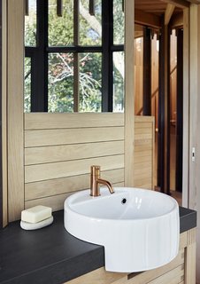 The bathroom tap is by Vola and the sink is by Ceramica Flaminia.