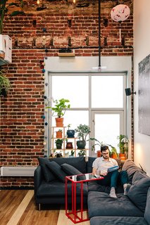 Inside his San Francisco living room, Max Heinritz kicks back on a Söderhamn sectional from IKEA. "In Tokyo, everything is space-efficient, nothing is wasted," he says. "I'm sort of going for that, too."