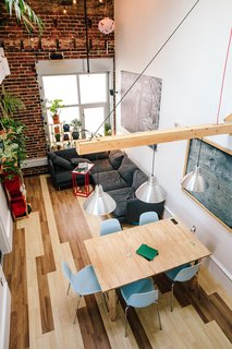 "I wanted to have a cozy dining area, so I thought about how I could do it in a way that wouldn't impede the projector," says Max. He mounted the device, a ViewSonic, atop the living room window. 