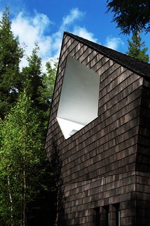 Growing Upward and Outward, a Cabin Expansion Mirrors the Trees - Photo 7 of 10 - Cedar shingles wrap the exterior.