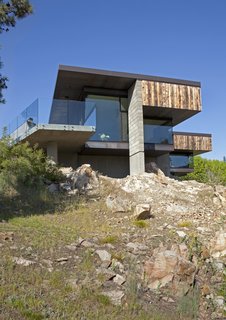 The charred-wood facade on Silping Wong and Jon Friesen’s house in western Canada was hand-done by Jon and his father. They used Douglas fir, a thick, corky wood that is local to the region.