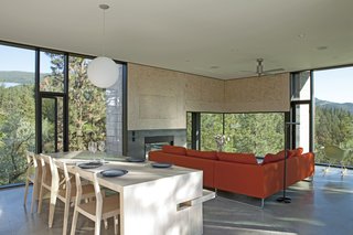 The living area includes a red Canyon sectional by Bensen and a Pensi ceiling fan by Modern Fan Company. 