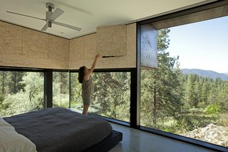 Protruding overhead cupboards increase storage space and reduce solar gain. The bed is Dodu by Blu Dot.