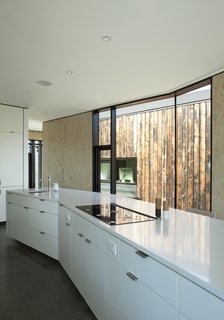 In the kitchen, the cabinetry is by High Country Cabinets and the countertop is Caesarstone. 