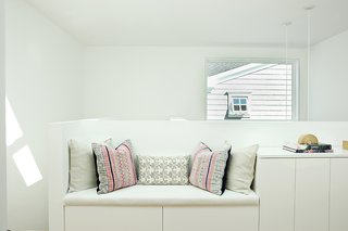 The upstairs corridor features a custom bench and cushions. 
