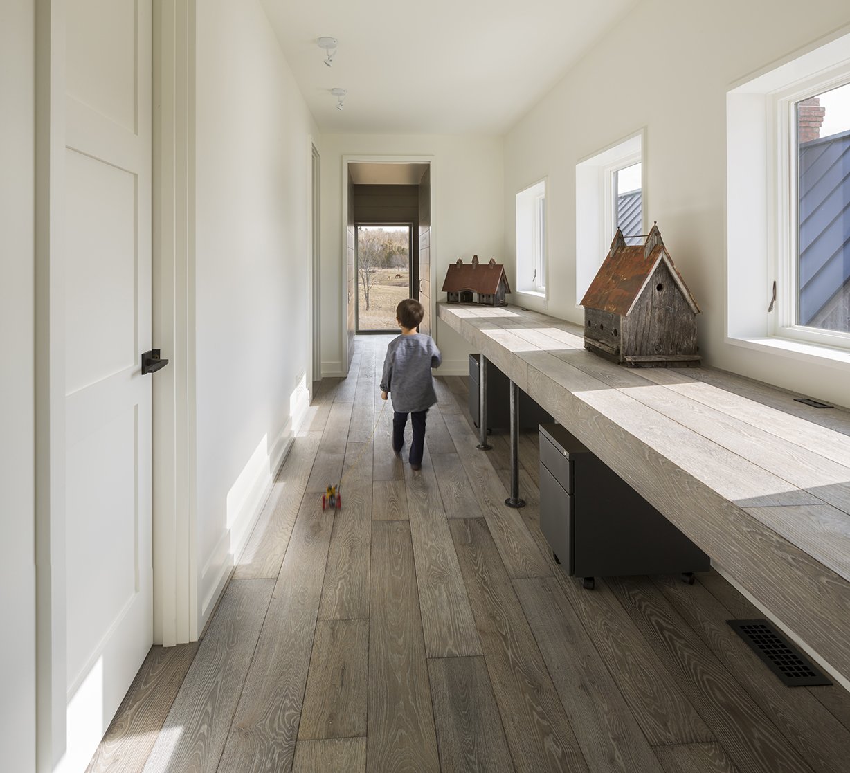 Photo 10 Of 12 In An Artist And Farmer Work With A Toronto Based Hallway And Um Hardwood Floor Antique Looking Birdhouses Are Displayed In A Office Space
