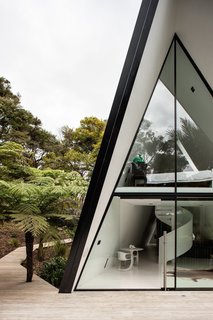 The tent-like home responds to the challenging site in a dynamic way. 