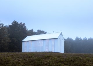 A Louis Kahn-Inspired Barn That’s Lined With Floor-to-Ceiling Shutters - Photo 1 of 3 -