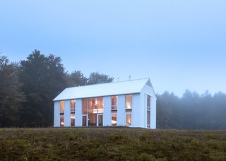 A Louis Kahn-Inspired Barn That’s Lined With Floor-to-Ceiling Shutters - Photo 2 of 3 -