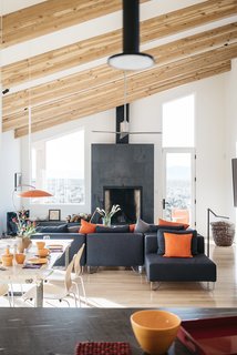 A Rookie Designer and Her Builder Father Create an Artist's Sculptural Loft in the Desert - Photo 3 of 10 - The living/dining room occupies a long, high-ceilinged space. The sectional is from CB2. 
