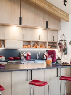 A Rookie Designer and Her Builder Father Create an Artist's Sculptural Loft in the Desert - Photo 4 of 10 - The kitchen cabinets hold dishes by Butterpie Productions. 