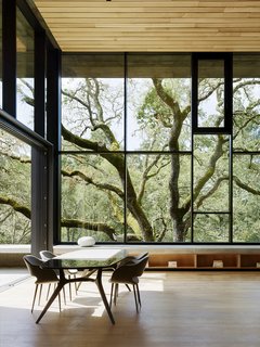 Nature Drove the Design of This Sculptural, Cor-Ten Steel House in Northern California - Photo 2 of 13 - DZINE Concept did the interior design throughout. The dining room features a Liquid table by Baxter and Charme chairs from Busnelli. 