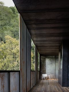 Nature Drove the Design of This Sculptural, Cor-Ten Steel House in Northern California - Photo 8 of 13 - A second-floor "pacing" deck marks Faulkner’s design, as it gives the residents the feeling of being indoors and in the landscape at once. "The deck runs along the second floor, adjacent to a bedroom," says the architect, who shaded the area with perforated steel screens and more solid Cor-Ten steel. 