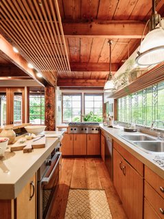 Repurposed Ship Materials and 100-Year-Old Beams Make Up This Tree House-Like Home - Photo 9 of 18 -