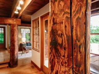 Repurposed Ship Materials and 100-Year-Old Beams Make Up This Tree House-Like Home - Photo 5 of 18 -