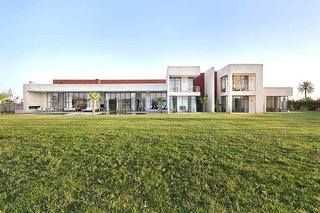 The Amizmiz House sits on a two-acre piece of land that's filled with gardens and a stunning indoor/outdoor pool. 