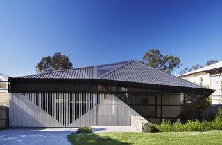 An Edgy Slatted Facade Conceals a Striking Indoor/Outdoor Home in Brisbane - Photo 1 of 11 -