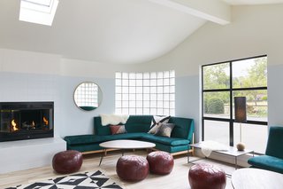 The lobby, anchored by a pair of green velvet sofas and a fireplace, combines a lounge area and general store with beverages and snacks; games to play by the pool, in the room, or on the road; and a curated selection of retail goods.