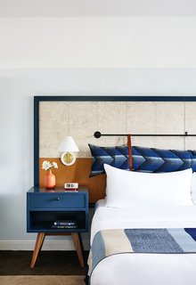 Three-hundred thread count sheets provide a good night's sleep, while rain showers and Grapefruit Sage products from the onsite spa contribute to a pampered experience.