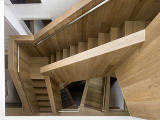 A Historic Victorian in San Francisco Is Meticulously Transformed Into a Modern Family Home - Photo 11 of 26 - The stairs are made of fumed and stained, engineered oak with a solid oak cap. Thanks to its complex geometry, no level is the same.