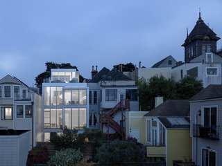 A Historic Victorian in San Francisco Is Meticulously Transformed Into a Modern Family Home - Photo 8 of 26 - The rear facade is illuminated at night.