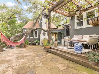 Feel at Home While Exploring Austin at One of These Modern Short-Term Rentals - Photo 15 of 17 - This charming guesthouse sits adjacent to a main residence that was built in 1927 to resemble a European cottage. Casement windows provide beautiful views of the gardens and century-old oak trees. 