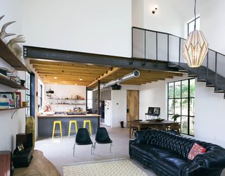 Feel at Home While Exploring Austin at One of These Modern Short-Term Rentals - Photo 9 of 17 - Completed in 2014 by Pavonetti Office of Design, the Garden Street house showcases a modern, industrial-barn aesthetic. 