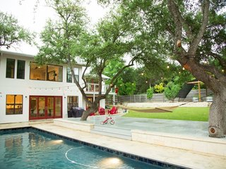 Feel at Home While Exploring Austin at One of These Modern Short-Term Rentals - Photo 10 of 17 - This 3,800-square-foot home boasts a warm contemporary design. With five bedrooms, a full-sized pool, fire pit, tree house, and trampoline, it's perfect for a big group traveling together or a pair of families with kids.