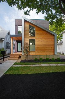 Clad in Cedar and Metal, an Indianapolis Home Gives a Modern Salute to its Traditional Surroundings - Photo 1 of 11 -
